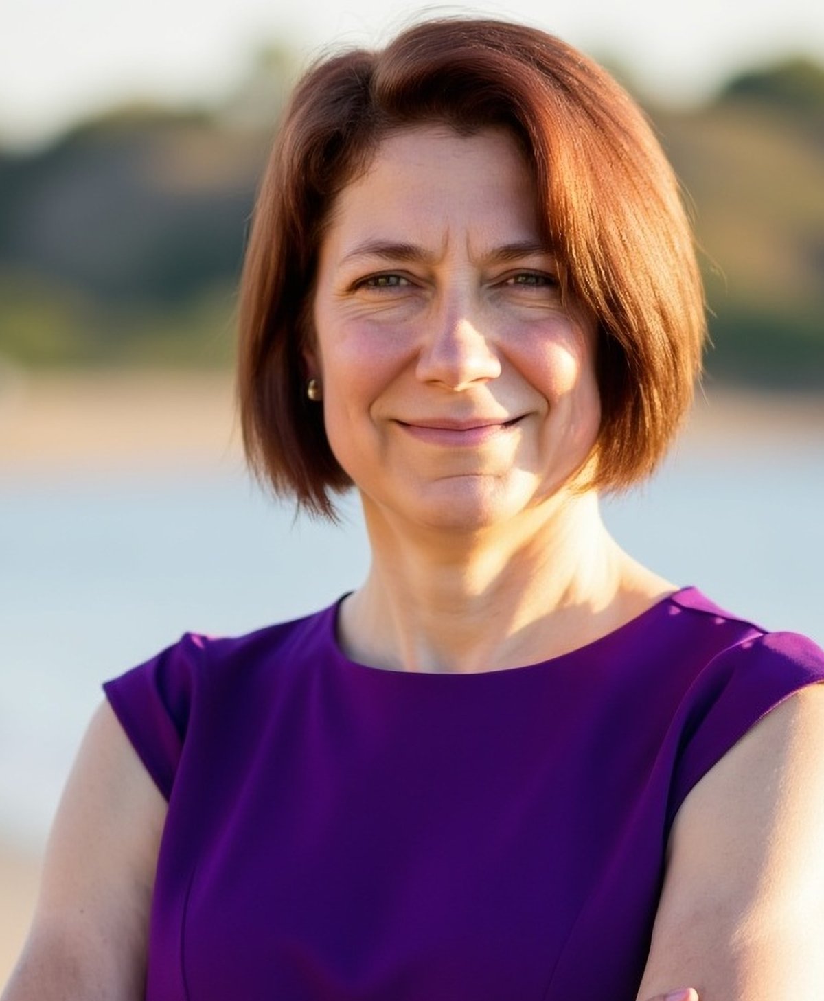 Catey, burnout recovery coach, smiling warmly